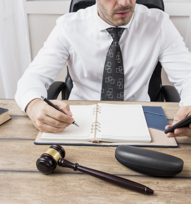 Lawyer with gavel and Notebook